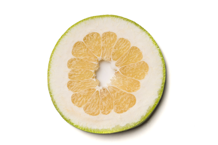 Cut Green Grapefruit (Jaffa Sweetie) slice, isolated on white background.