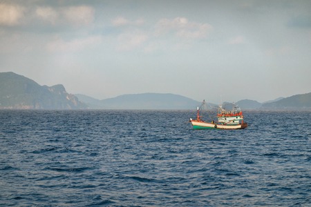 Fishing boat is out fishing. Fishermen is a career that has been popular in the seaside city of Thailand.の写真素材