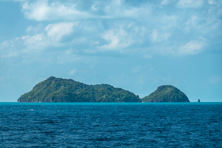 View of Ko Tay island touristic tropical destination near Samui Thailand. Turquoise Water and green trees on a Tropical Island.の写真素材