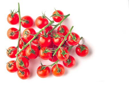 Cherry tomatoes stack isolated on white backgroundの写真素材