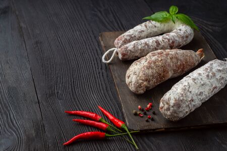 Three Grilled sausage of a different kind on a black backgroundの写真素材