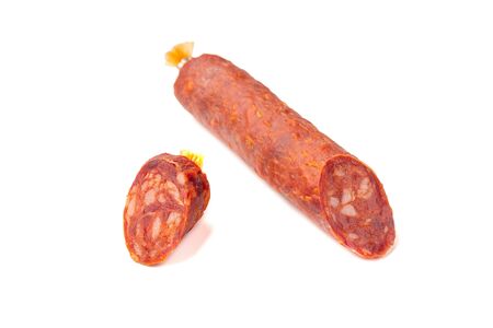 Fermented semi-dry, smoked sausage salami slices isolated on white backgroundの写真素材