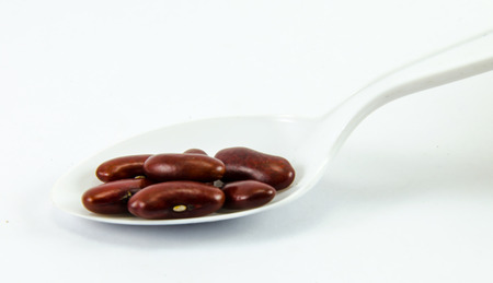Kidney Beans on white spoons