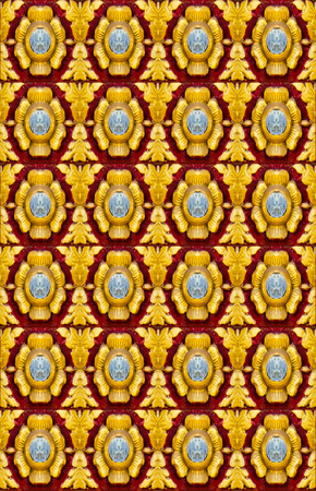 gold flower on red backgroundの写真素材