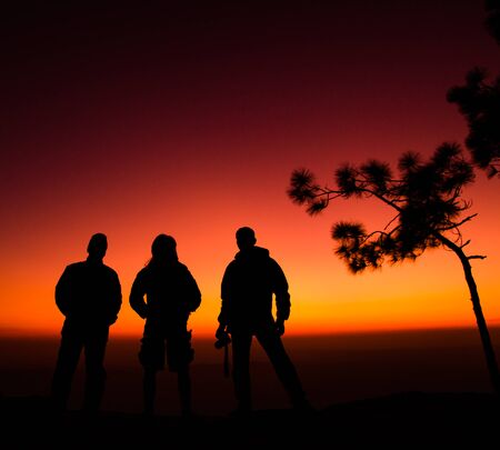 group of man standing on cliffの写真素材