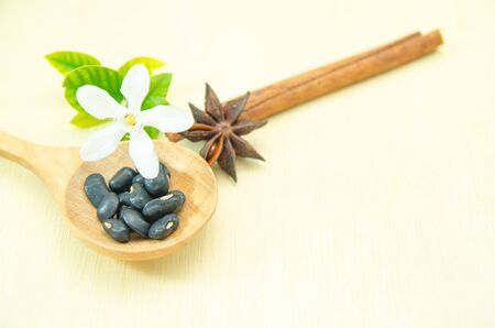 cinnamon and cinnamon stick on wood spoon and wood boardの写真素材