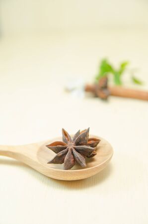 cinnamon and cinnamon stick on wood spoon and wood boardの写真素材