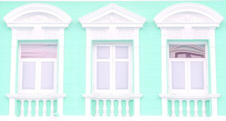 vintage cement art window exterior of an old buildingの写真素材