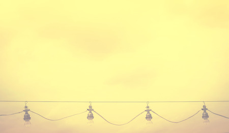 retro light blub on skyの写真素材