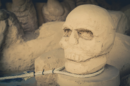 Ancient stone skull and rope Hanged nekedの写真素材