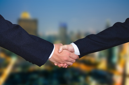 Successful business people handshaking closing a dealの写真素材