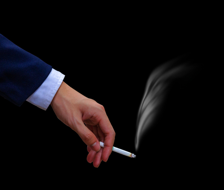 business man hand hold cigaretteの写真素材