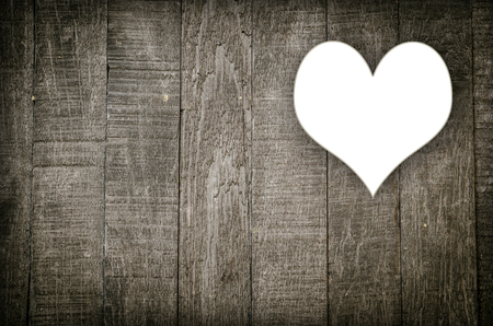 old wood background and heart hole blankの写真素材