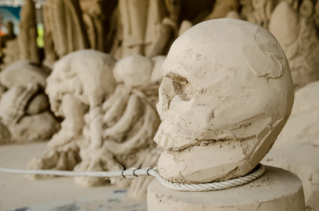 Ancient stone skull and rope Hanged nekedの写真素材