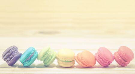 French macaroons on sack with wood background on filter colorの写真素材