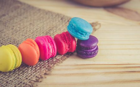 French macaroons on sack with wood background on filter colorの写真素材