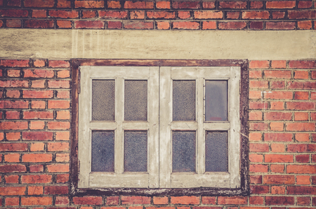 grunge brick wall and wooden frame windowの写真素材