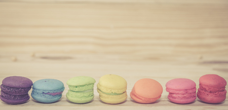 French macaroons on sack with wood background on filter colorの写真素材