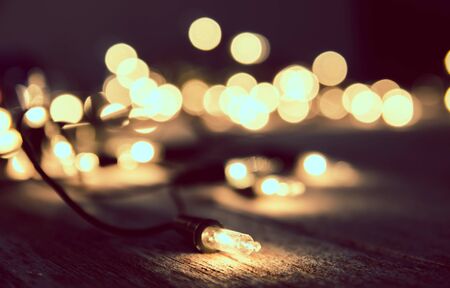 christmas light decor on wood backgroundの写真素材