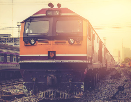 vintage train in train station with sun light and vintage tone color