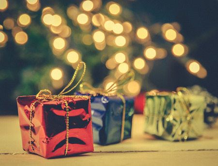 christmas gift boxes decor on light backgrond process in coss color toneの写真素材