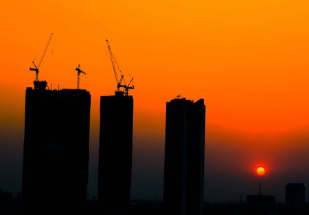 sillouette construction site at sunrise time background
