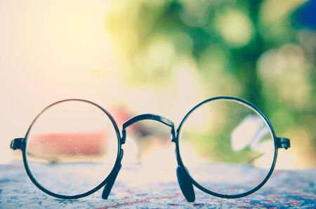 Artwork in retro style, Spectacles and book , vintage styled,selective focusの写真素材