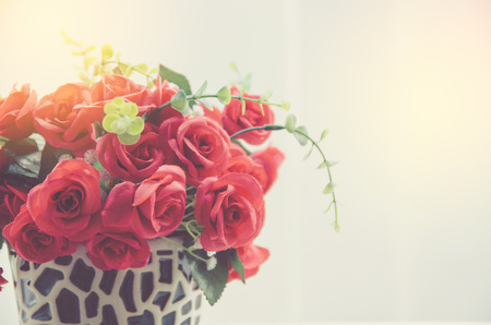 bunch of red rose flower on table with nature blur backgroundの写真素材