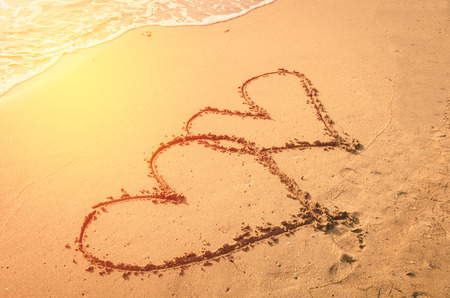 couple heart on sand beach , loveの写真素材
