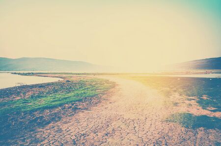 landscape photo of river  and meadow with blur mountain backgroundの写真素材