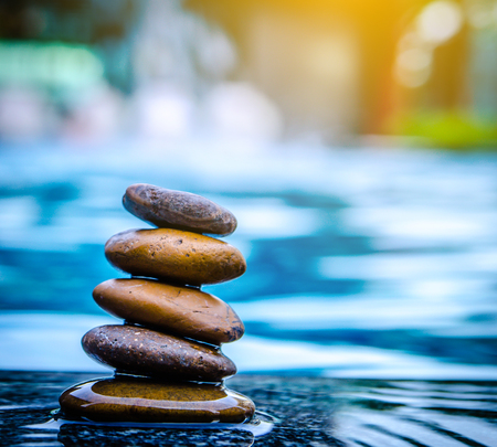 Spa still life with water lily and zen stone in a serenity pool.soft focus light.の写真素材