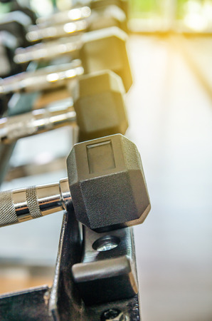 dumbbell in gym - vintage effect and sun flare filter effectの写真素材