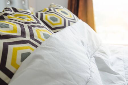  bed sheets and pillows messed up after nights sleep.の写真素材