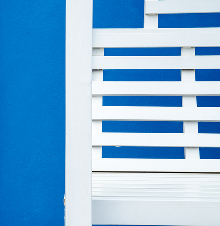 white chair on blue backgroundの写真素材