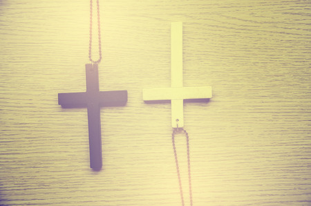 wooden cross on wood background