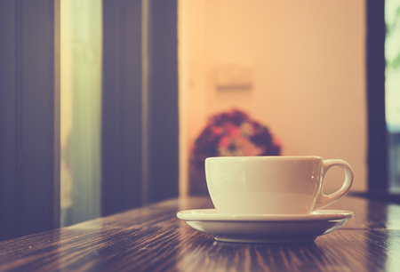cup of coffee on table in cafeの写真素材