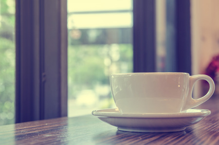 cup of coffee on table in cafeの写真素材