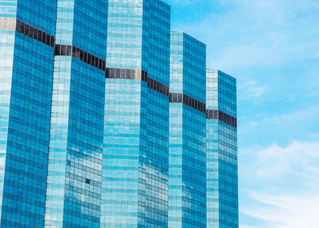 Modern glass silhouettes of skyscrapers in the cityの写真素材