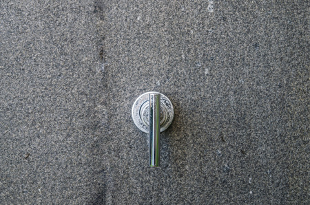 Water tap with water drop outdoor green park backgroundの写真素材