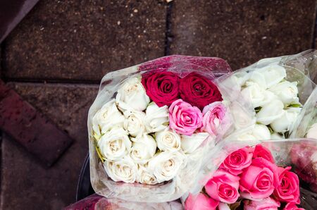 bunch of red rose flower on table with nature blur backgroundの写真素材