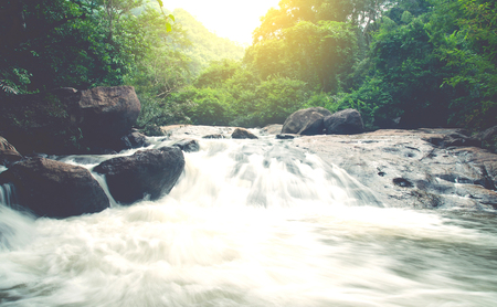 Wonderful Waterfall with rainbows in deep forest at national park, Thailand.の写真素材