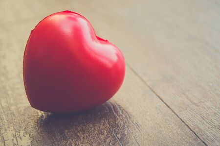 red  hearts placed nicely on a turquoise vintage wood backgroundの写真素材