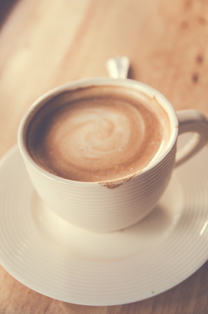 cup of coffee on table in cafeの写真素材