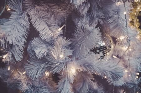 white christmas tree with golden ball ornament decoration on tree , copyspace for banner text or greetingの写真素材