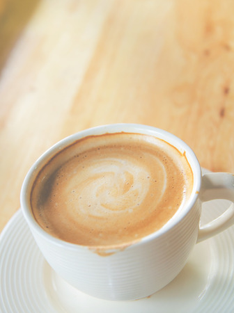 cup of coffee on table in cafeの写真素材