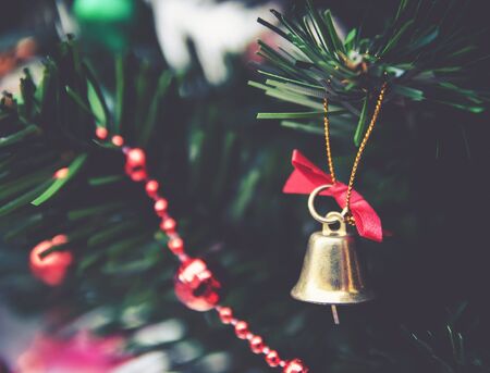 Jingle bell and Christmas tree branchesの写真素材