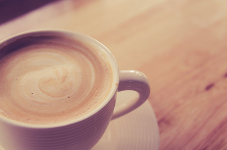 cup of coffee on table in cafeの写真素材