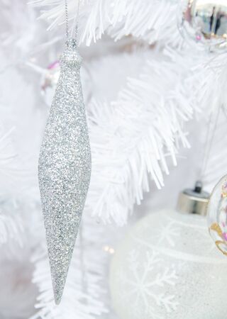 white christmas tree with ball ornament decoration on tree , copyspace for banner text or greetingの写真素材