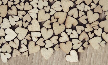 wood heart  on wood background, valentine concept with selective red heartの写真素材