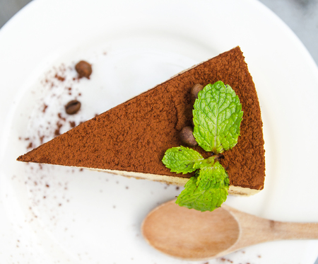 chocolate cake with wood spoonの写真素材